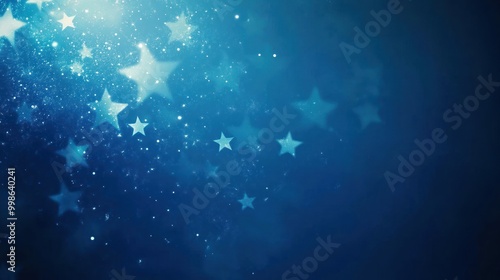 Abstract blue background with blurred white stars and glitter.
