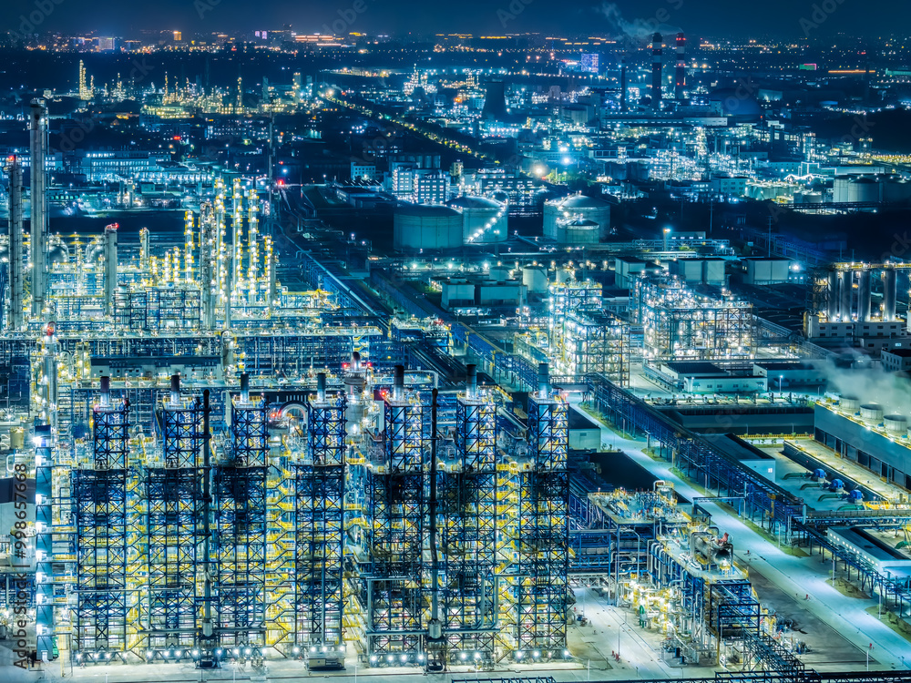 Oil refinery chemical plant industrial equipment buildings at night Oil refinery chemical plant industrial equipment buildings at night