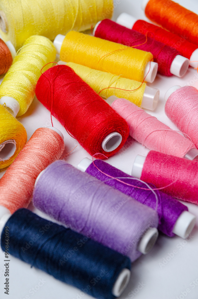 Top view of many colorful thread spools background Top view of many colorful thread spools background