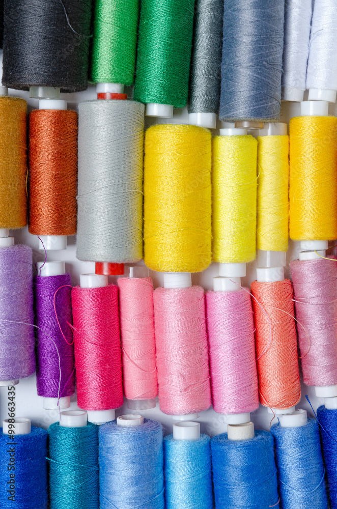 Top view of many colorful thread spools background Top view of many colorful thread spools background