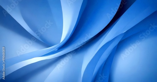 a close-up view of abstract blue and white shapes, creating a sense of movement and fluidity photo