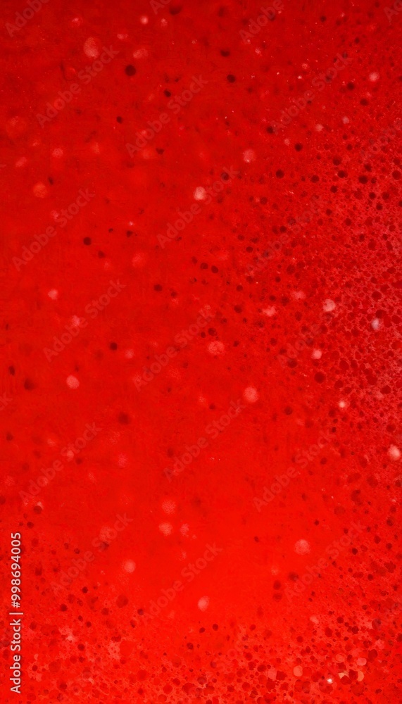 a close-up view red liquid surface with numerous small white dots scattered across it, creating a textured and speckled appearance a close-up view red liquid surface with numerous small white dots scattered across it, creating a textured and speckled appearance