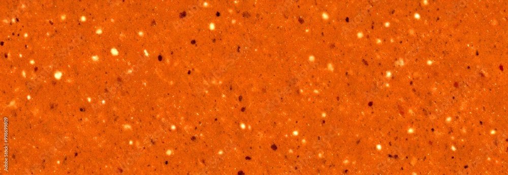 a close-up view brown, speckled surface, possibly a stone or concrete base, with small white dots scattered throughout a close-up view brown, speckled surface, possibly a stone or concrete base, with small white dots scattered throughout