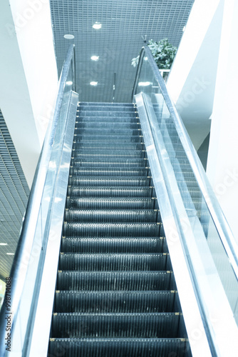 Empty escalator steps on staircase in airport
