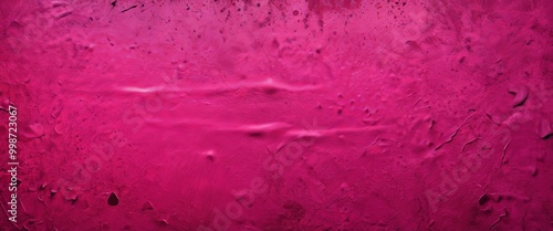 a close-up view textured pink surface with a glossy finish, featuring small bumps and cracks photo