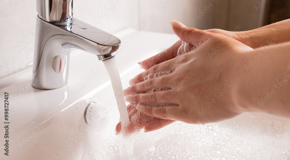 Hand washing. Women's hands wash their hands with soap under running water. Hand washing. Women's hands wash their hands with soap under running water.