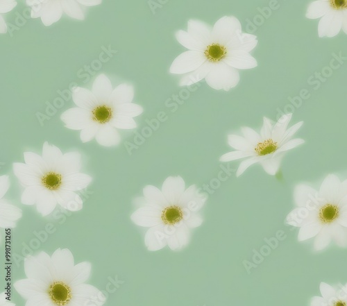 A repeating pattern of white daisy flowers with green centers against a mint green background