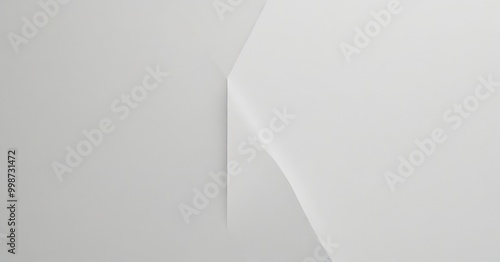 a white paper with a subtle, curved line running through it, creating a sense of depth and dimension photo