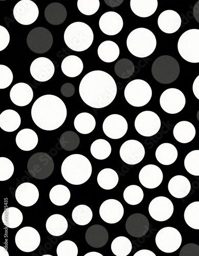 A black and white featuring a pattern of white circles scattered across a dark background