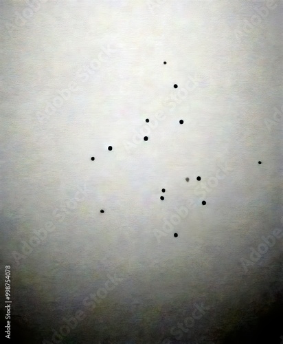 a dark, blurred background with numerous small black dots scattered throughout, resembling a constellation or a pattern.