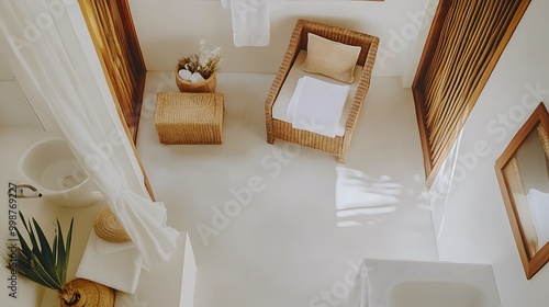 A birds-eye view of a minimalist bathroom with a clean white sink, neutral accessories, and a neatly folded towel, creating a calm and uncluttered atmosphere. photo