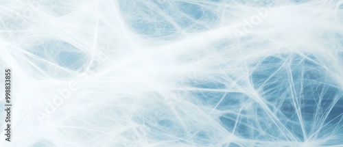 A close-up of delicate white cobwebs against a soft blue background, evoking a light and ethereal feel.