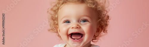 funny toddler having a blast isolated on pastel bacckground