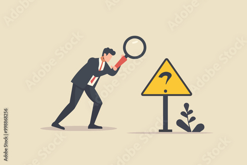 Businessman using a magnifying glass to examine a question mark sign, representing analysis and investigation.
