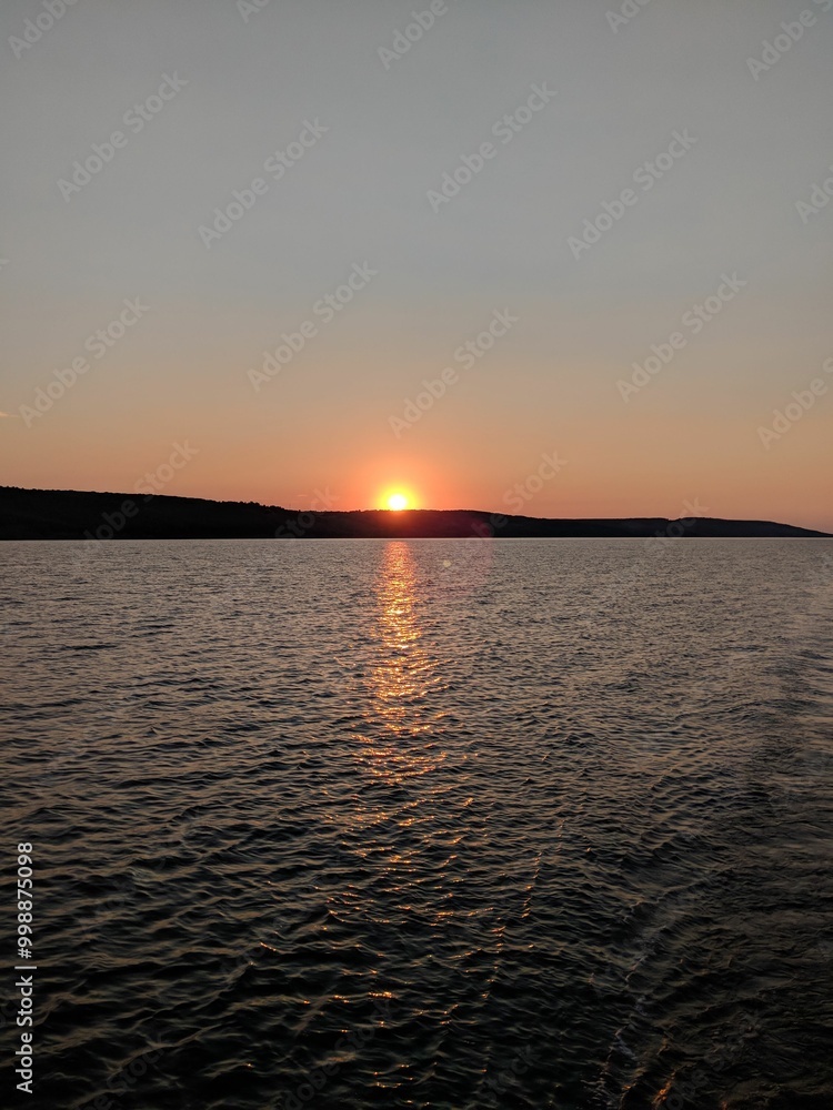 Obraz premium sunset over the river
