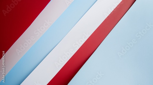 Free Download Abstract composition of diagonal red, white, and blue paper lines, creating a modern and dynamic visual appeal. - GFXLoad