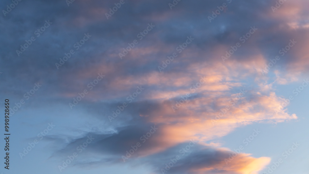 Sky background. Bright evening sunset sky with dramatic clouds. Sky background. Bright evening sunset sky with dramatic clouds.