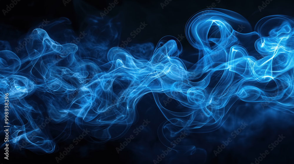 Fototapeta premium Swirling blue smoke flows gracefully across a dark background, creating an ethereal and mysterious atmosphere with its flowing, translucent forms.