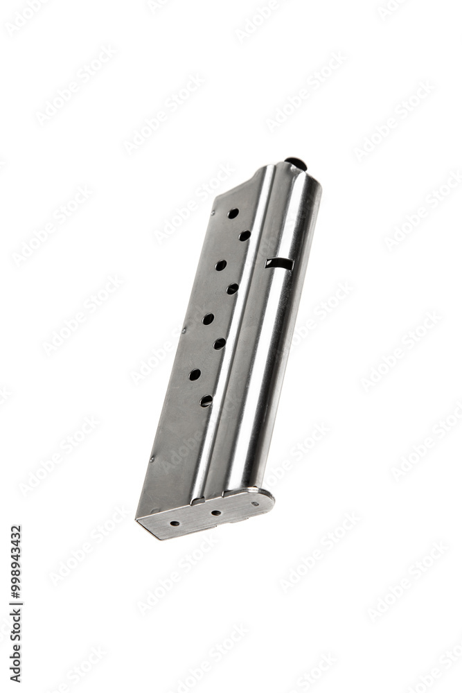 Metal pistol magazine for 9 mm cartridges. Clip for ammunition. Isolate on a white back. Metal pistol magazine for 9 mm cartridges. Clip for ammunition. Isolate on a white back.