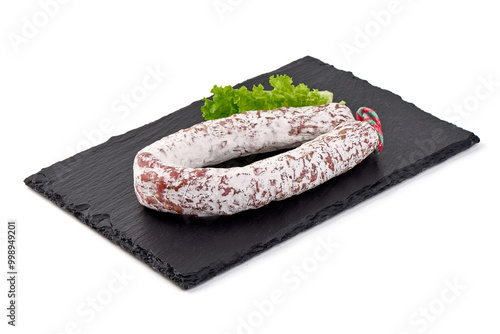 Traditional Spanish Fuet thin dried sausage with slices, Close-up, isolated on a white background. photo