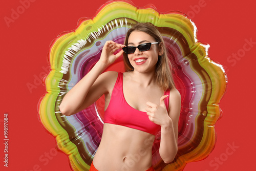 Young woman in swimsuit wit...