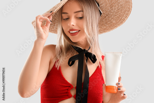 Young woman with sunscreen ...