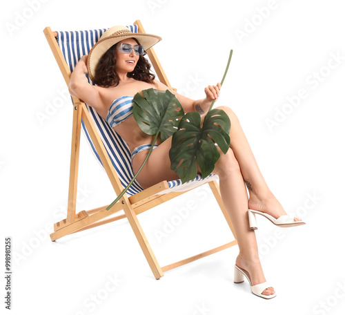 Young woman with palm leave...