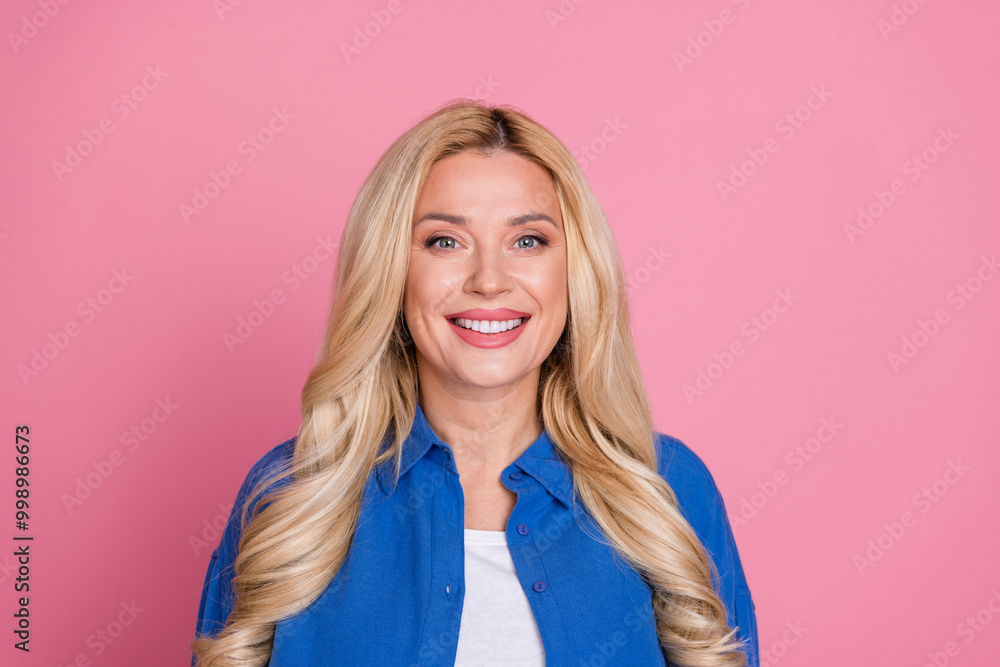Photo of adorable lovely woman wear blue shirt smiling empty space isolated pink color background Photo of adorable lovely woman wear blue shirt smiling empty space isolated pink color background