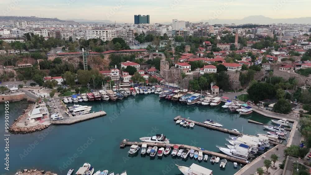Aerial View of Residential District of City at Sea Coast. Old Town Marina in Small Bay. Antalya, Turkey. Aerial View of Residential District of City at Sea Coast. Old Town Marina in Small Bay. Antalya, Turkey.
