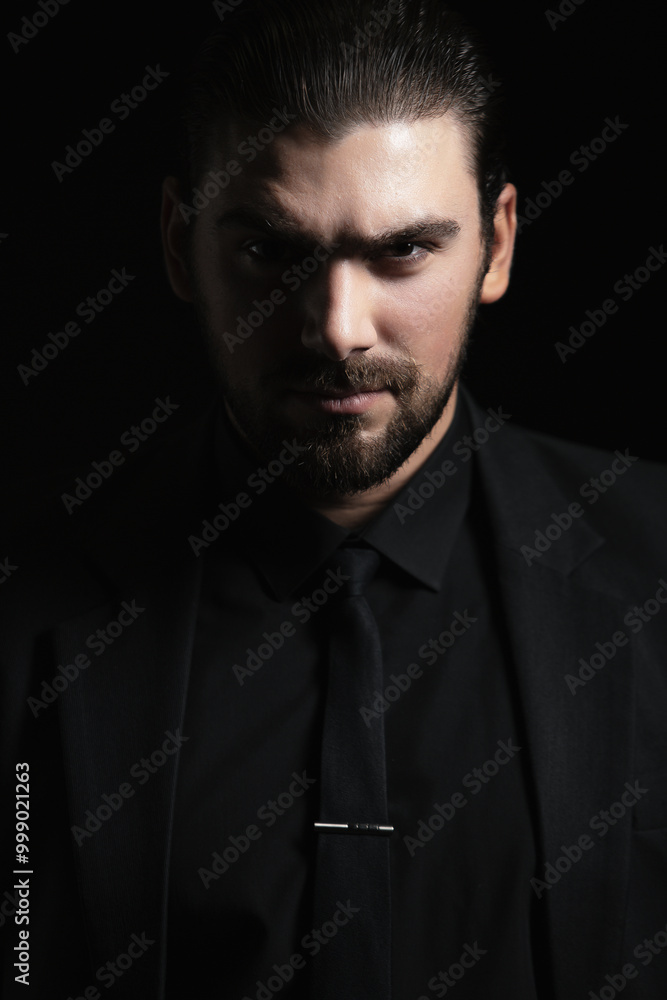 Strict male portrait. The guy in the classic black suit. Strict male portrait. The guy in the classic black suit.