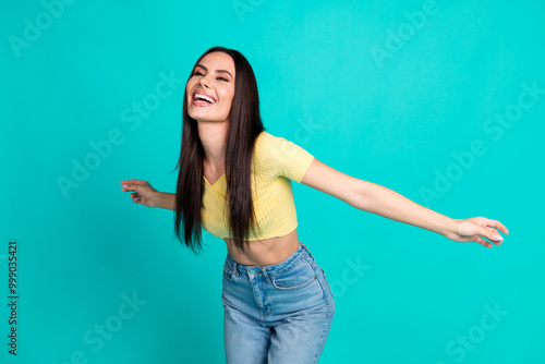 Portrait of nice young woman good mood dancing wear top isolated on turquoise color background