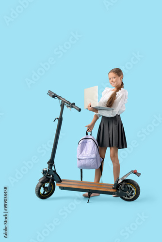 Cute schoolgirl with laptop...