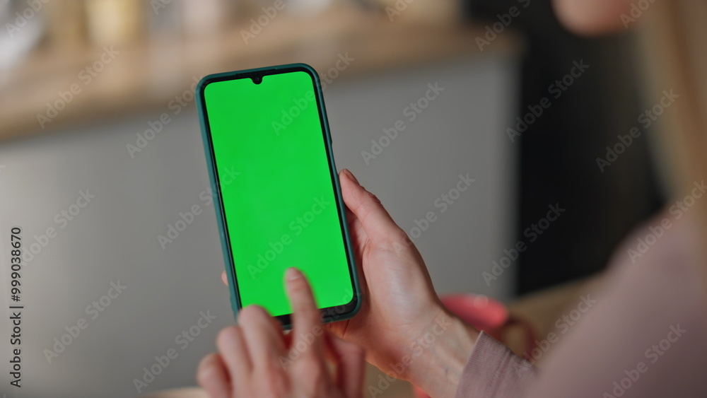 Girl scrolling mockup mobile phone making online order at home kitchen close up. Girl scrolling mockup mobile phone making online order at home kitchen close up.