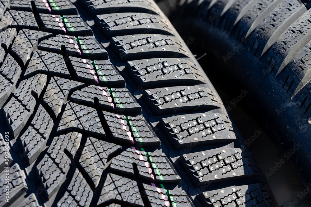 Sharp tread of new winter tires ready for the seasonal change. New tires are important for increasing road safety