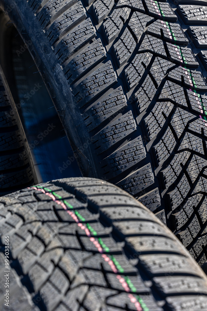 Sharp tread of new winter tires ready for the seasonal change. New tires are important for increasing road safety