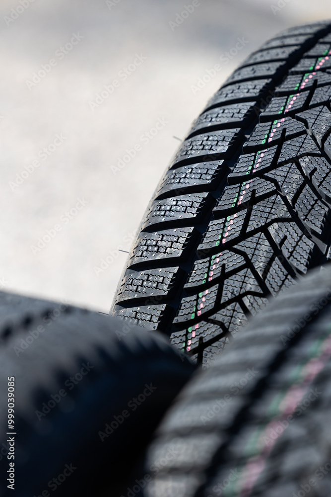 Sharp tread of new winter tires ready for the seasonal change. New tires are important for increasing road safety