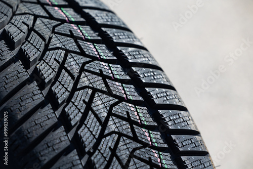 Obraz na płótnie Sharp tread of new winter tires ready for the seasonal change. New tires are important for increasing road safety w salonie