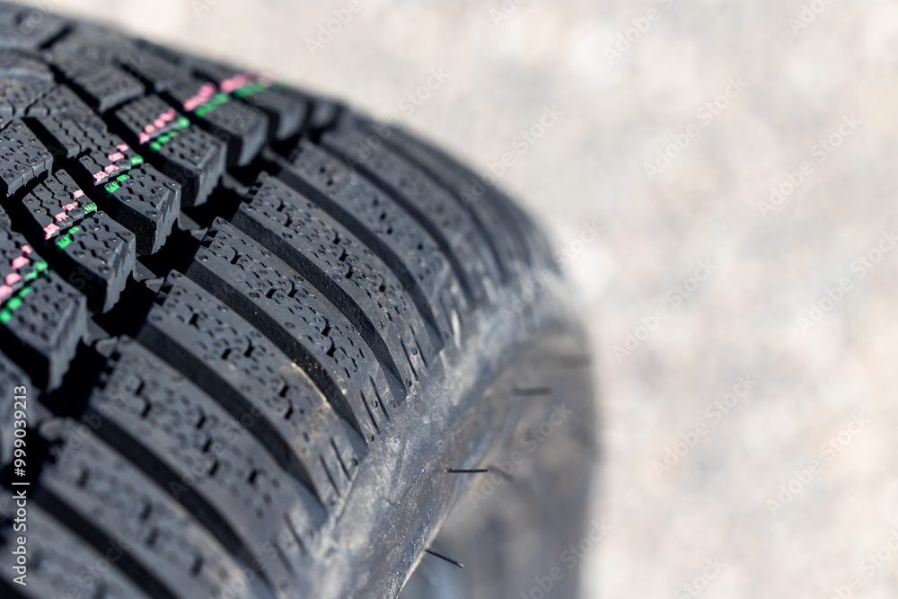 Sharp tread of new winter tires ready for the seasonal change. New tires are important for increasing road safety