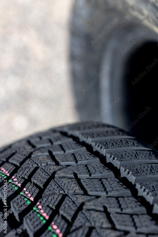 Sharp tread of new winter tires ready for the seasonal change. New tires are important for increasing road safety