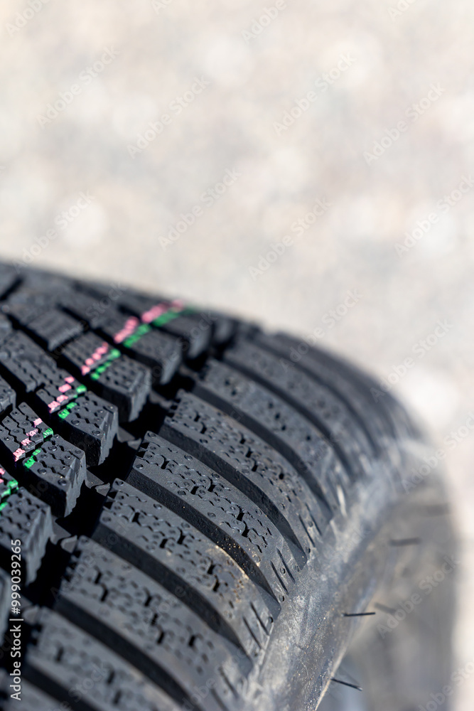 Sharp tread of new winter tires ready for the seasonal change. New tires are important for increasing road safety
