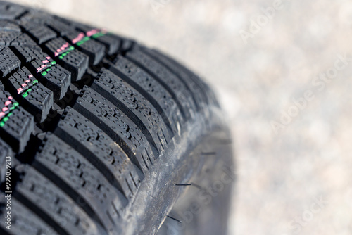 Sharp tread of new winter tires ready for the seasonal change. New tires are important for increasing road safety