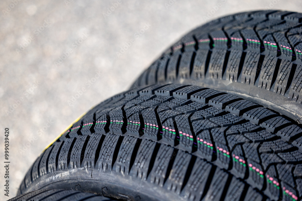 Sharp tread of new winter tires ready for the seasonal change. New tires are important for increasing road safety