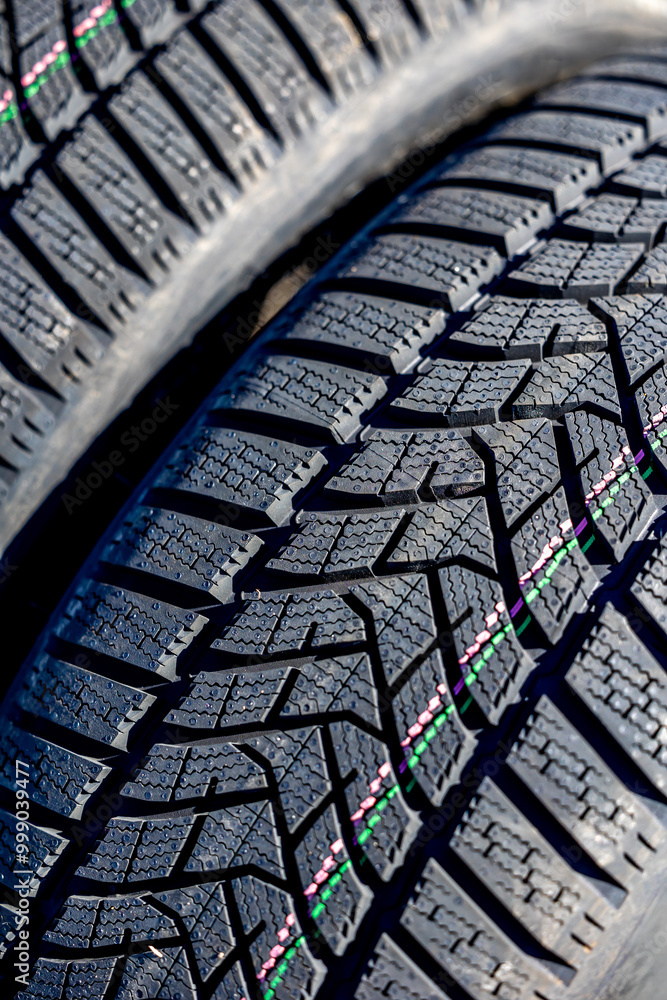 Sharp tread of new winter tires ready for the seasonal change. New tires are important for increasing road safety