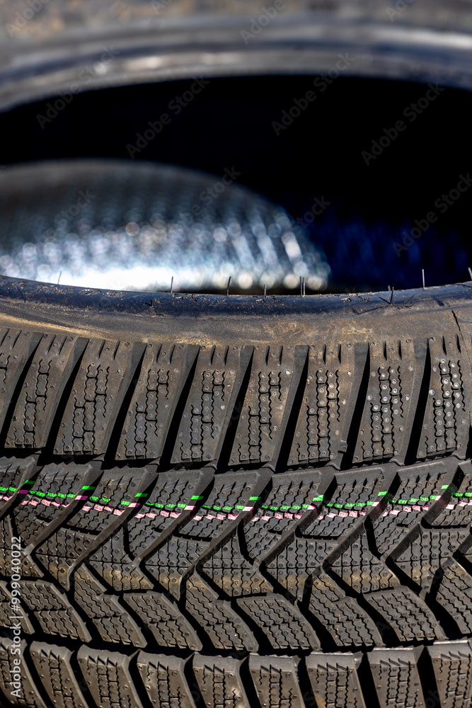 Sharp tread of new winter tires ready for the seasonal change. New tires are important for increasing road safety