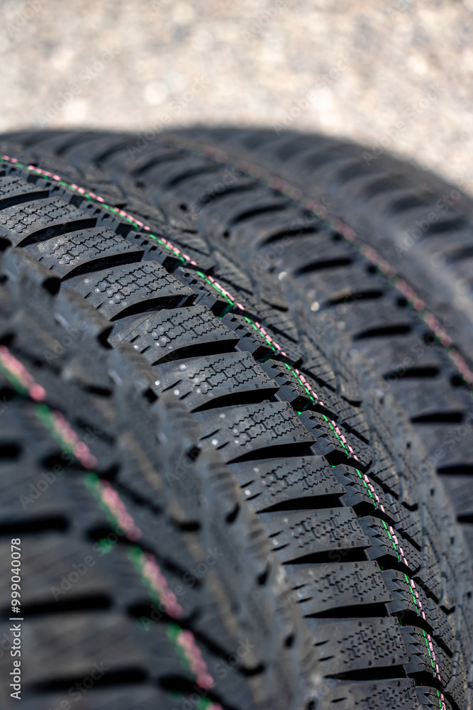 Sharp tread of new winter tires ready for the seasonal change. New tires are important for increasing road safety