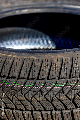 Sharp tread of new winter tires ready for the seasonal change. New tires are important for increasing road safety