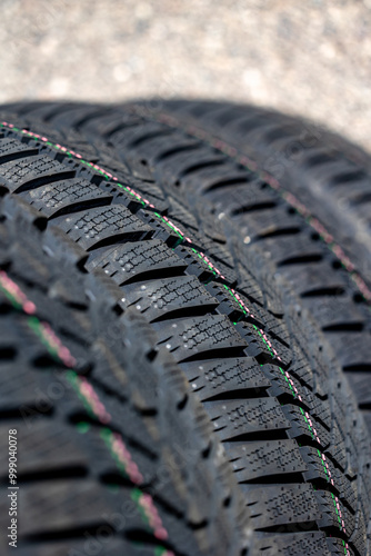 Obraz na płótnie Sharp tread of new winter tires ready for the seasonal change. New tires are important for increasing road safety w salonie