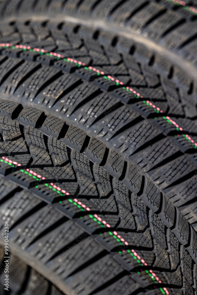 Sharp tread of new winter tires ready for the seasonal change. New tires are important for increasing road safety