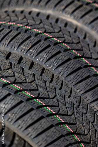 Obraz na płótnie Sharp tread of new winter tires ready for the seasonal change. New tires are important for increasing road safety w salonie