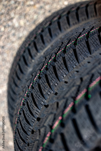 Sharp tread of new winter tires ready for the seasonal change. New tires are important for increasing road safety